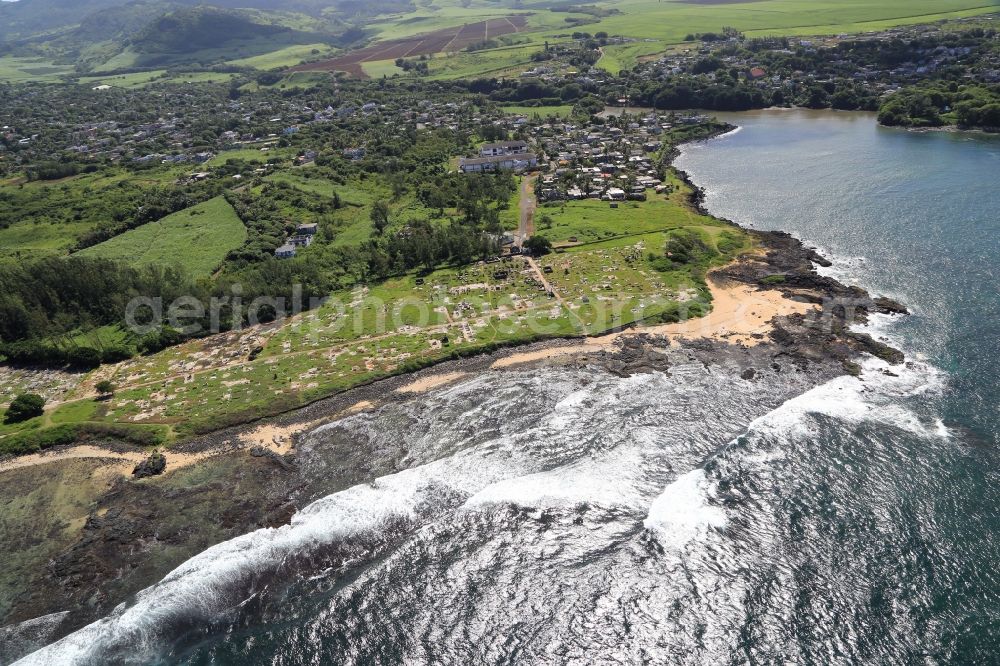 Surinam from the bird's eye view: Graveyard at the beach, lagoon and coral reef at Surinam on the south coast of the island Mauritius in the Indian Ocean