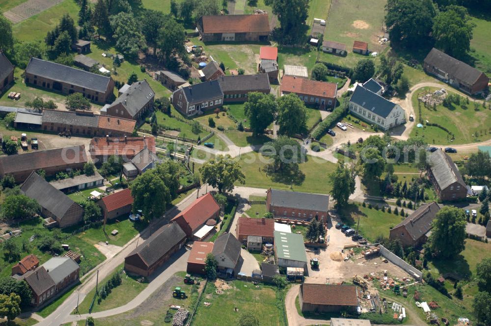 Aerial image Kuhblank - Blick auf das Dorf Kuhblank, das ein Ortsteil der Gemeinde Breese im brandenburgischen Landkreis Prignitz ist. Kuhblank wurde als Rundling angelegt und hat nur eine Straße, die in das Dorf hinein- und herausführt.