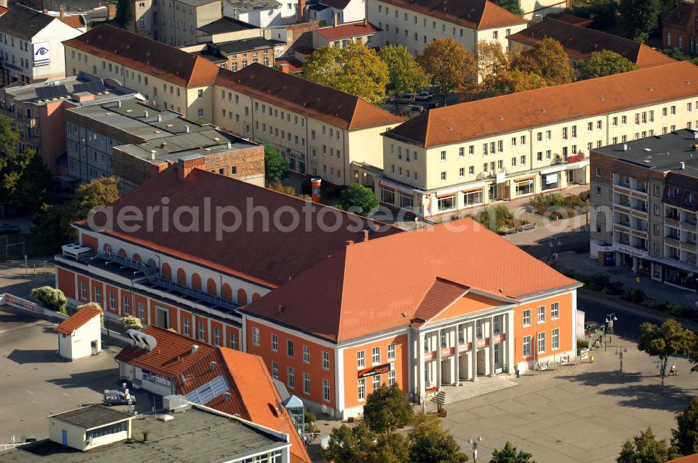 Aerial photograph Rathenow - Blick auf das Kulturzentrum am Märkischem Platz. 1958 wurde das Gebäude als Kreiskulturhaus eröffnet. Nach der Wende wurde das Gebäude bis 1998 hauptsächlich als Theater genutzt. Durch die Landesentwicklungsgesellschaft / LEG Brandenburg wurde Haus bis 2004 saniert und als Kulturzentrum wieder eröffnet. Neben dem Theater gibt es noch an dere Veranstltungsräume, ein Restaurant und das Optikindustriemuseum. Kontakt: Kulturzentrum Rathenow gGmbH, Märkischer Platz 3, 14712 Rathenow, Tel. +49(0)3385 5190-42, Fax -31, info@kulturzentrum-rathenow.de