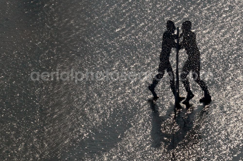 Aerial image Berlin - Outdoor art- installation Molecule Man on the water surface on the flux flow of the Spree An den Treptowers in Berlin in Germany