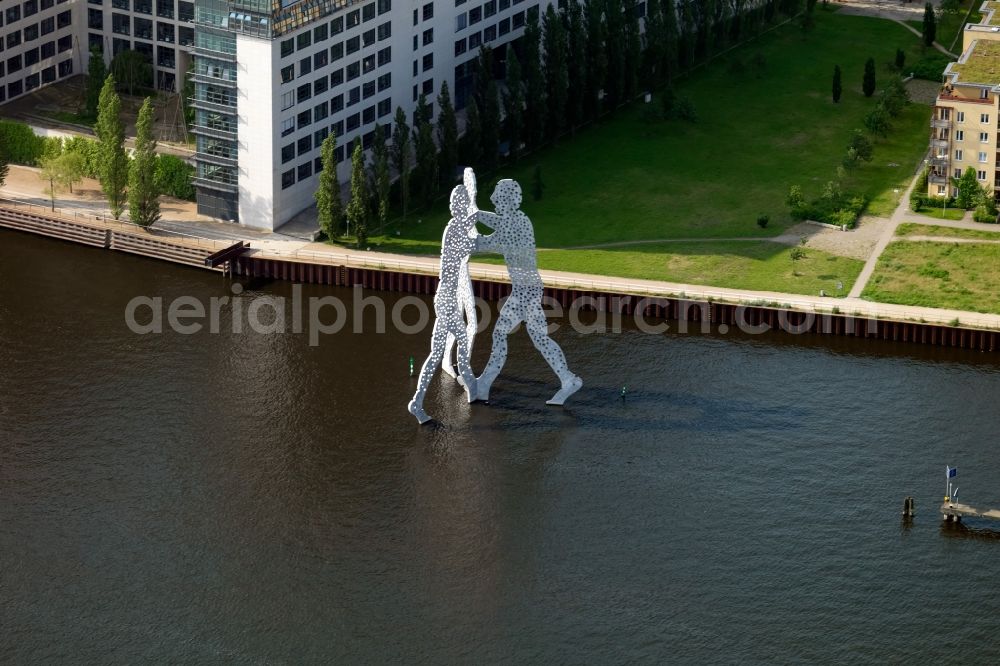 Berlin from the bird's eye view: Outdoor art- installation Molecule Man on the water surface on the flux flow of the Spree An den Treptowers in Berlin in Germany