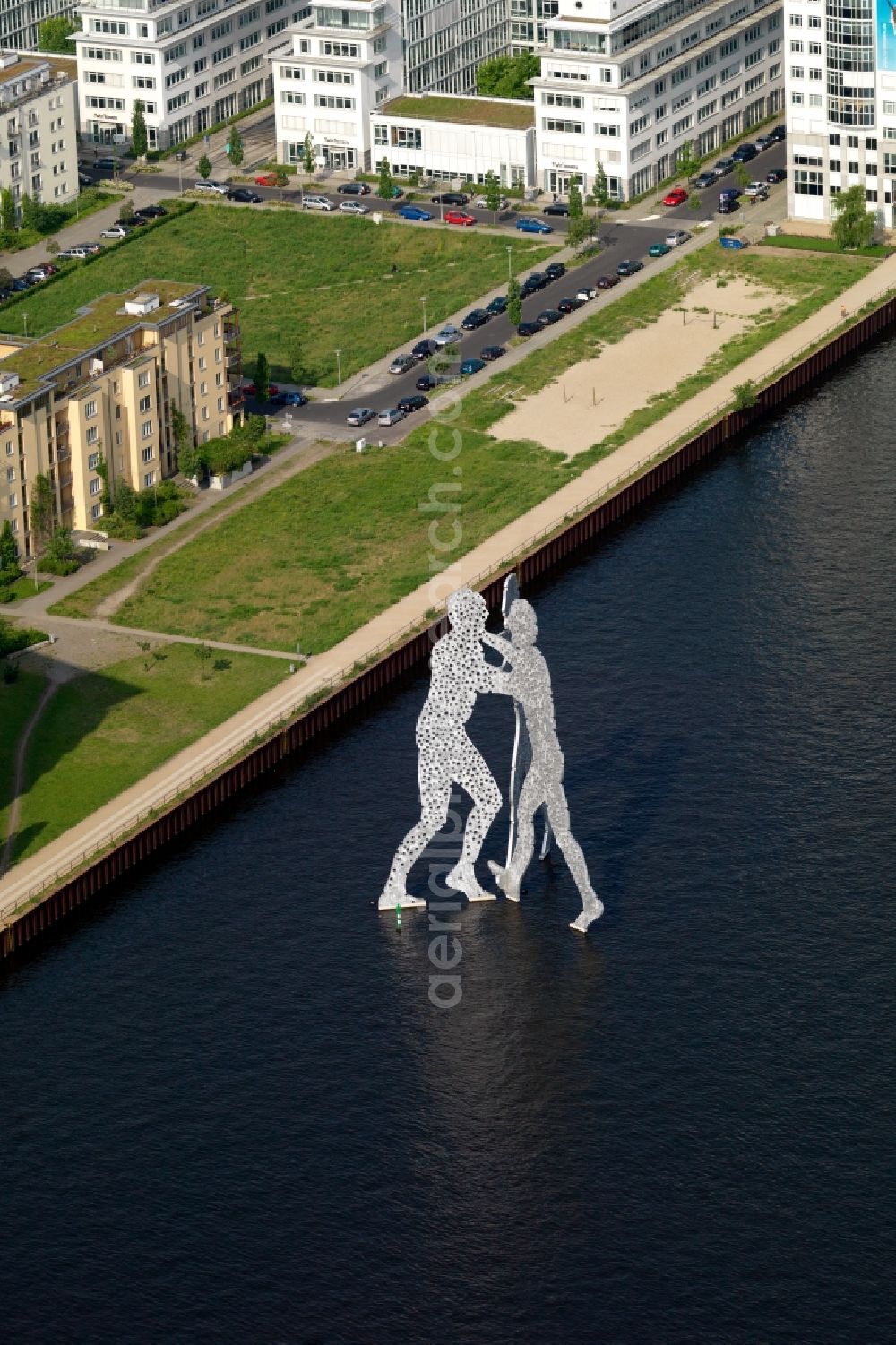 Aerial photograph Berlin - Outdoor art- installation Molecule Man on the water surface on the flux flow of the Spree An den Treptowers in Berlin in Germany