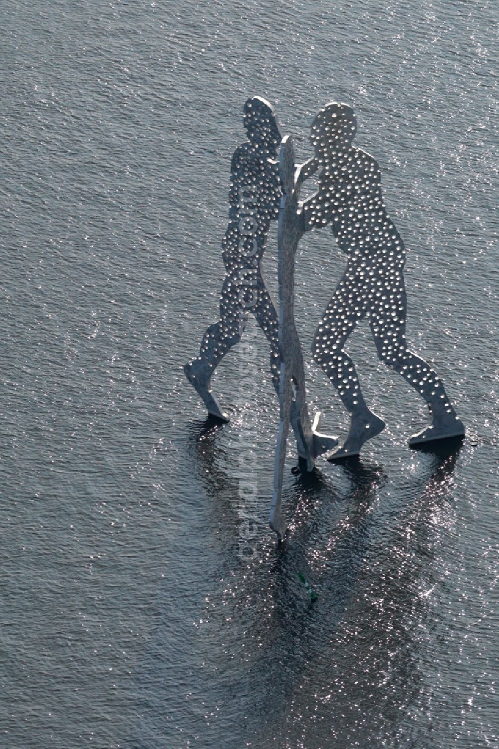 Berlin from the bird's eye view: Outdoor art- installation Molecule Man on the water surface on the flux flow of the Spree An den Treptowers in Berlin in Germany