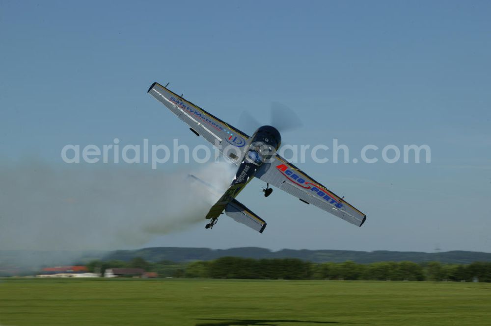 Aerial image Bad Ditzenbach - Kunstflug-Pilot Uli Dembinski fliegt sein Flugzeug vom Typ Jakowlew Jak-55 auf dem Flugplatz Bad Dietzenbach EDPB umgangssprachlich das Berneck in Baden-Württemberg. Acrobatic flight Pilot Uli Dembinski flies over the Bad Dietzenbach airfield in Baden-Wuerttemberg.