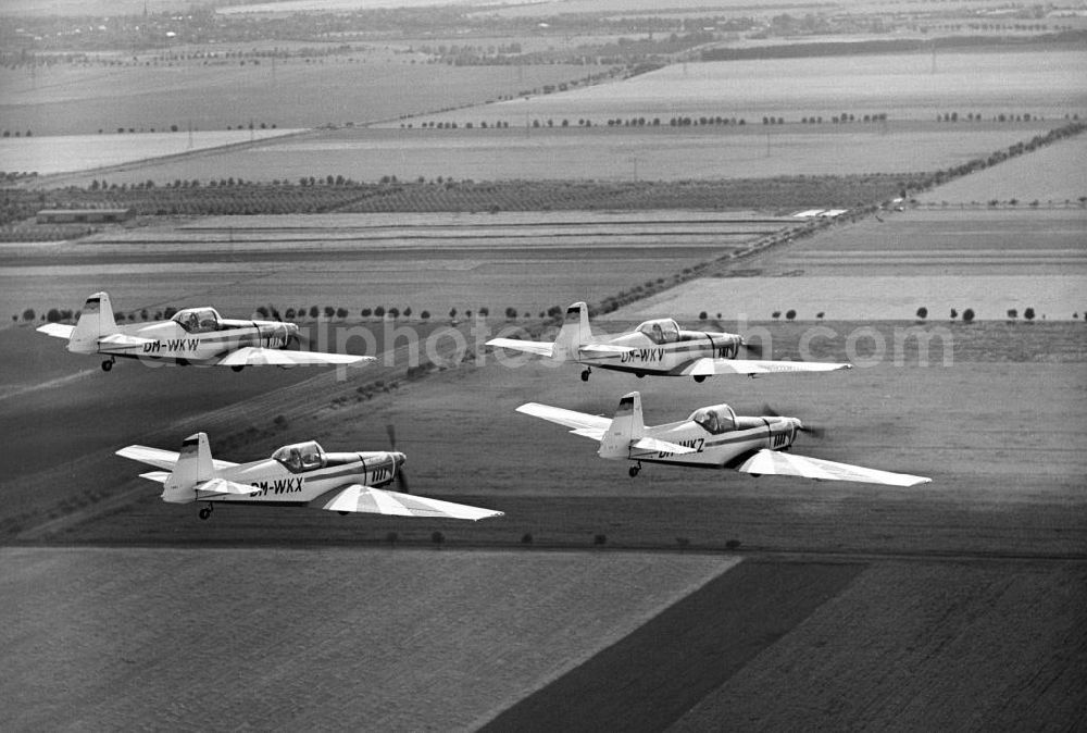 Aerial image Cochstedt - Die Kunstflug Weltmeisterschaftsstaffel der DDR von Zlin Z-526 A Akrobat, ein tschechoslowakisches Sport- und Kunstflugzeug der Trener Reihe, bei der 5. Weltmeisterschaft im Motorkunstflug vom 18. - 31.08.1968 auf dem Flugplatz Magdeburg / Cochstedt.