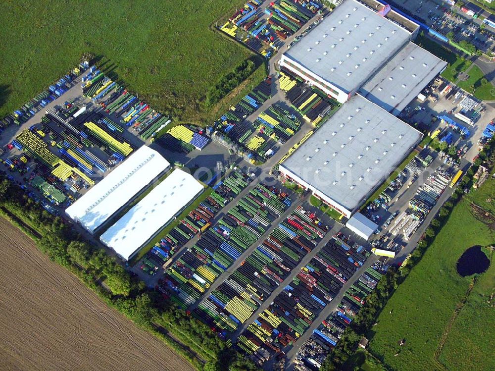 Aerial image Neuruppin (Brandenburg) - Blick auf das Kunststoffwerk für Entsorgungsbehälter der Otto-Gruppe im Gewerbegebiet von Neuruppin Otto Entsorgungssysteme GmbH & Co KG, Mr. Roel Nizet (General Manager), Mr. Andreas Ziegler (Commercial Manager), Friedrich-Buckling-Strasse 8, Gewerbegebiet, D-16816 Neuruppin, Tel: +49-3391-516506, andreas.ziegler@otto-gruppe.de