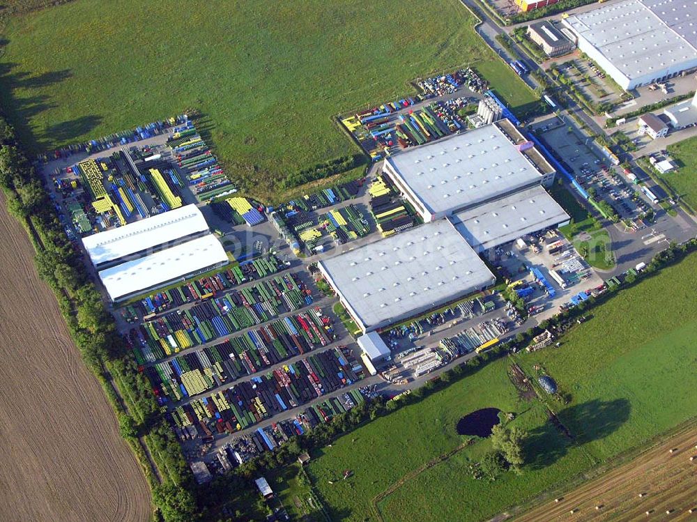 Aerial photograph Neuruppin (Brandenburg) - Blick auf das Kunststoffwerk für Entsorgungsbehälter der Otto-Gruppe im Gewerbegebiet von Neuruppin Otto Entsorgungssysteme GmbH & Co KG, Mr. Roel Nizet (General Manager), Mr. Andreas Ziegler (Commercial Manager), Friedrich-Buckling-Strasse 8, Gewerbegebiet, D-16816 Neuruppin, Tel: +49-3391-516506, andreas.ziegler@otto-gruppe.de