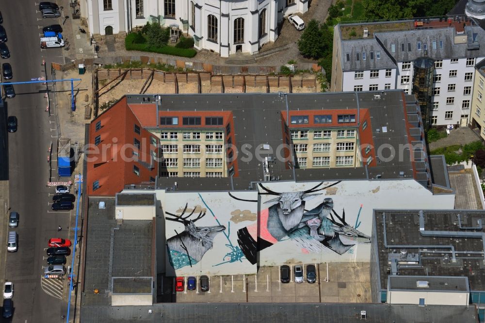 Berlin from above - A work by the artist Hiroyasu Tsuri alias Two One in the backyard of a residential building in Berlin-Mitte. You can see the picture of a women with several animals on the wall of a backyard parking in the Klosterstrasse