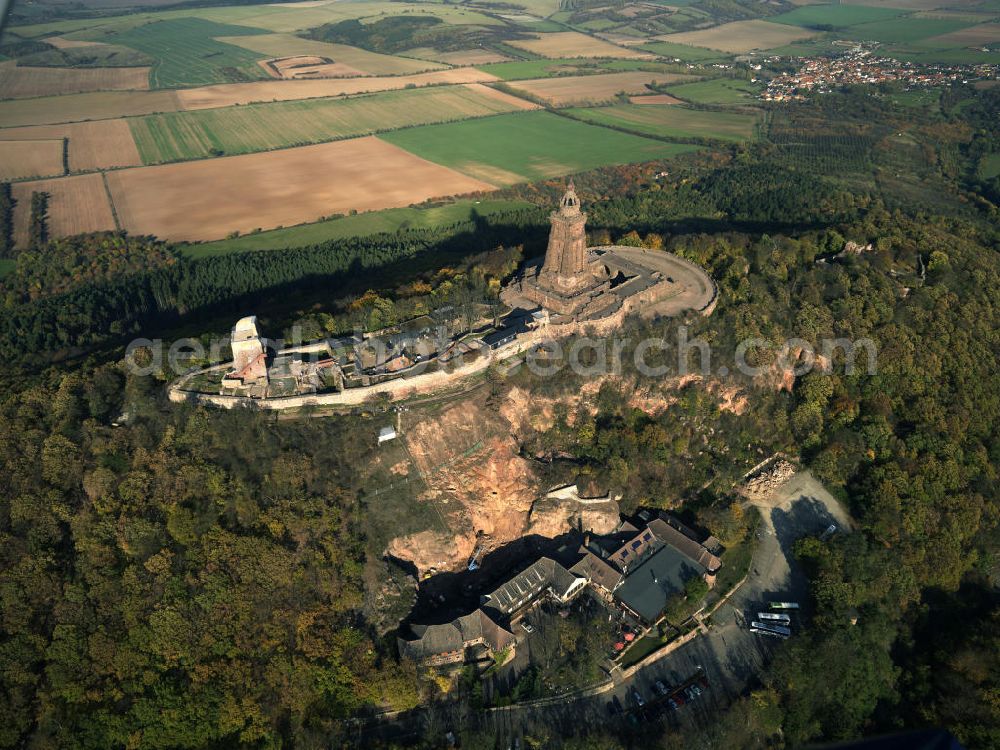 Aerial photograph Steinthaleben - Blick auf das Kyffhäuserdenkmal in Bad Frankenhausen. Das Kyffhäuserdenkmal (auch Barbarossadenkmal oder Kaiser-Wilhelm-Denkmal) auf der Kuppe des Kyffhäuserberges wurde 1890 bis 1896 zu Ehren von Kaiser Wilhelm I. errichtet. Es ist das drittgrößte Denkmal Deutschlands. View of the Kyffhäuser monument in Bad Frankenhausen. The Kyffhäuser monument (also Barbarossa Monument or Kaiser-Wilhelm-monument) on the top of the Mount Kyffhäuser was built from 1890 to 1896 in honor of Kaiser Wilhelm I.. It is the third largest monument in Germany.