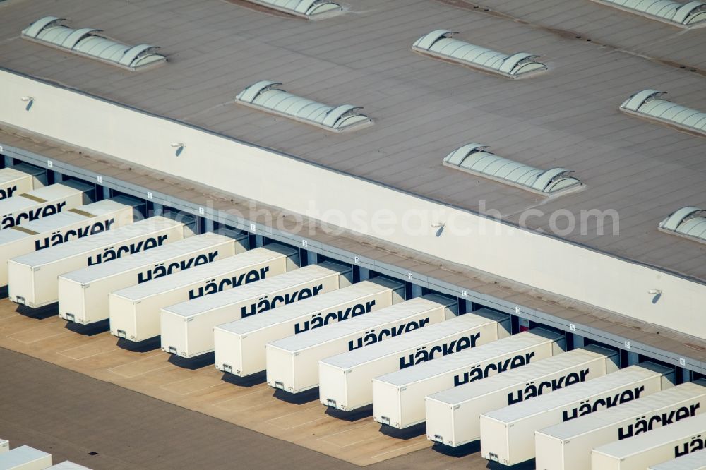 Rödinghausen from the bird's eye view: Bearing surface and sales area of Haecker Kuechen GmbH & Co. KG in the industrial area in Roedinghausen in the state North Rhine-Westphalia