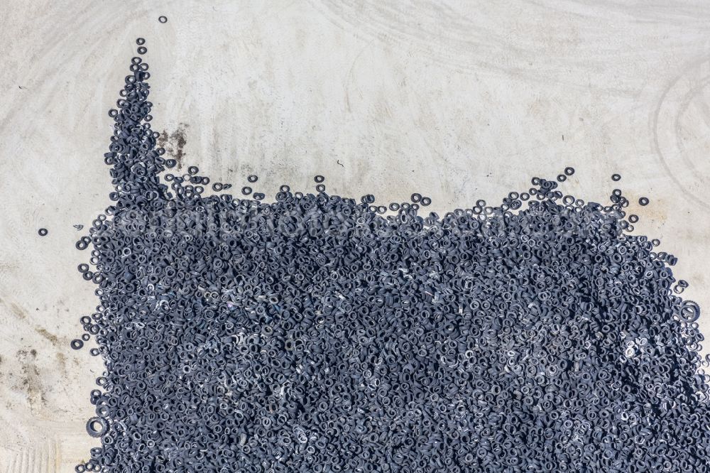 Harburg (Schwaben) from the bird's eye view: Bearing surface of a scrap tire pile, waiting in the cement plant for incineration, in the industrial area in Harburg (Schwaben) in Bavaria