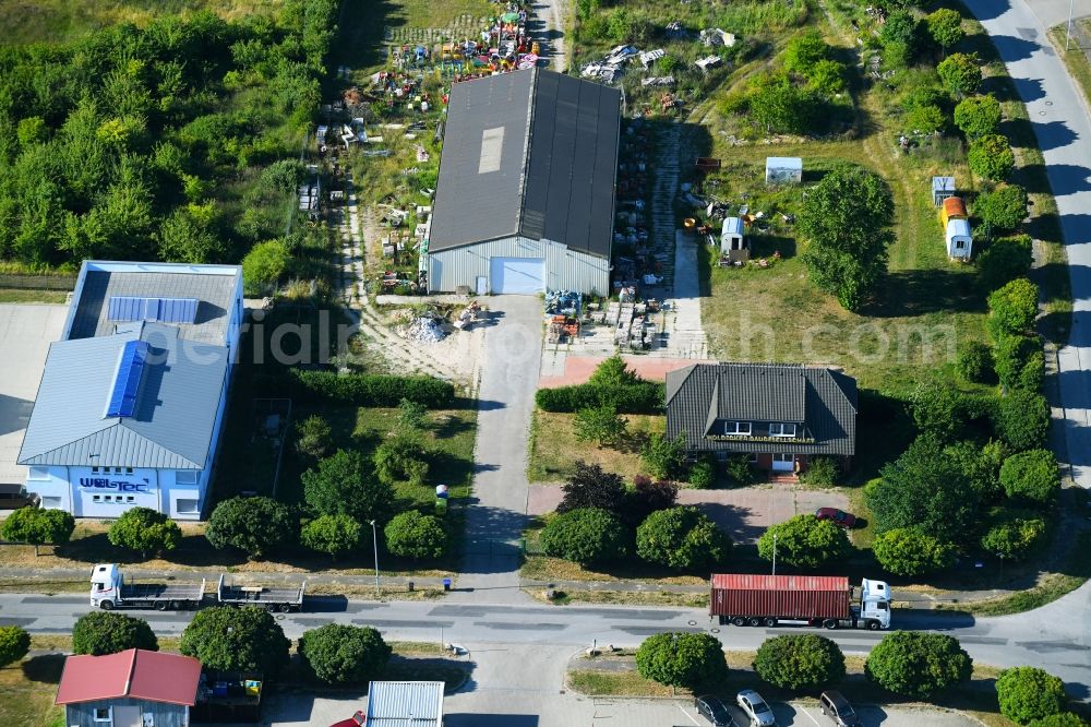 Woldegk from the bird's eye view: Bearing surface fuer discarded toy vending machines and driving machines on Muehlenblick corner Muehlengrandstrasse in the industrial area in Woldegk in the state Mecklenburg - Western Pomerania, Germany