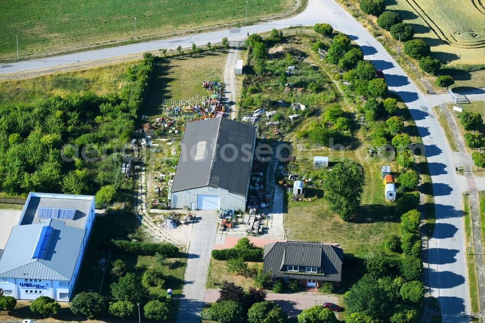 Aerial image Woldegk - Bearing surface fuer discarded toy vending machines and driving machines on Muehlenblick corner Muehlengrandstrasse in the industrial area in Woldegk in the state Mecklenburg - Western Pomerania, Germany