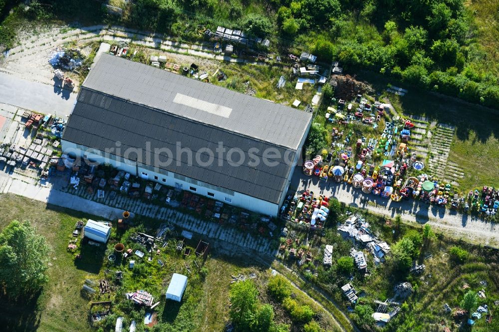 Aerial photograph Woldegk - Bearing surface fuer discarded toy vending machines and driving machines on Muehlenblick corner Muehlengrandstrasse in the industrial area in Woldegk in the state Mecklenburg - Western Pomerania, Germany