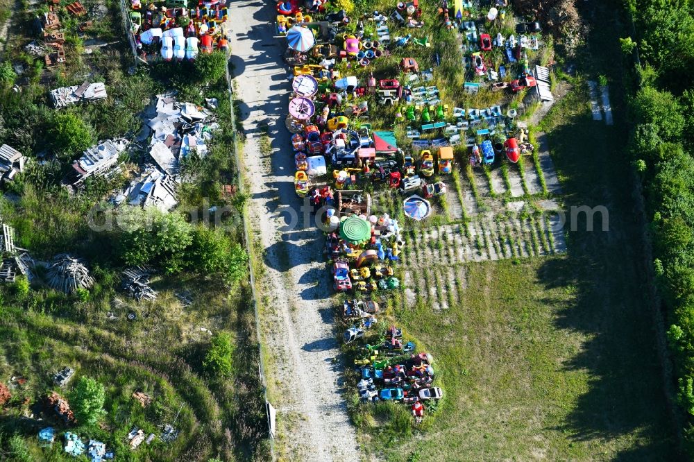 Aerial photograph Woldegk - Bearing surface fuer discarded toy vending machines and driving machines on Muehlenblick corner Muehlengrandstrasse in the industrial area in Woldegk in the state Mecklenburg - Western Pomerania, Germany