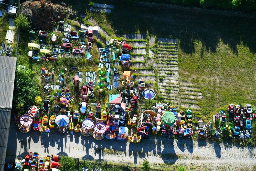 Aerial image Woldegk - Bearing surface fuer discarded toy vending machines and driving machines on Muehlenblick corner Muehlengrandstrasse in the industrial area in Woldegk in the state Mecklenburg - Western Pomerania, Germany