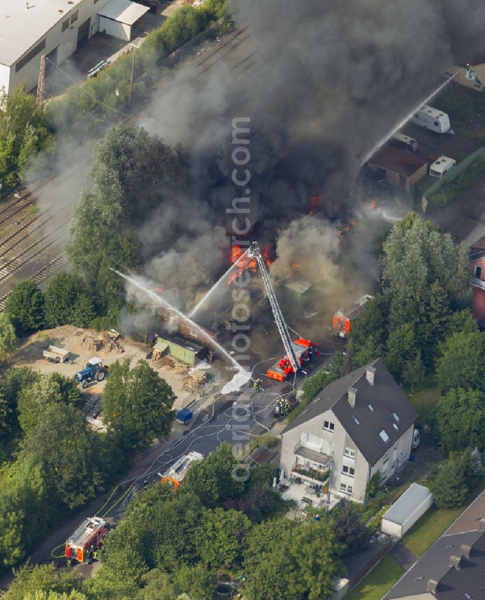 Aerial image Hagen - The fire extinguishing work on a destroyed by the fire warehouse in Hagen in North Rhine-Westphalia