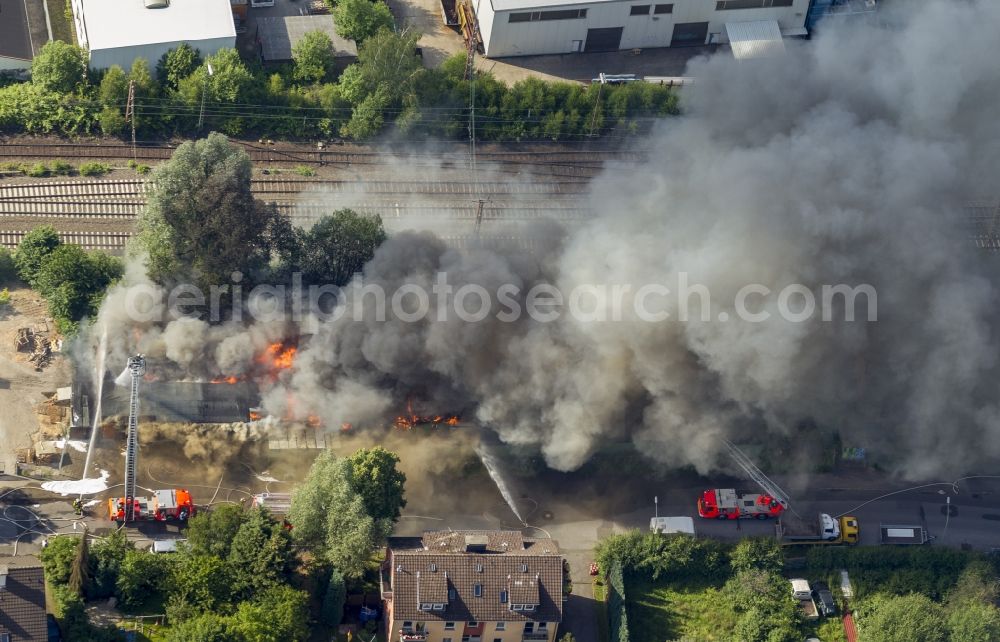 Hagen from above - The fire extinguishing work on a destroyed by the fire warehouse in Hagen in North Rhine-Westphalia