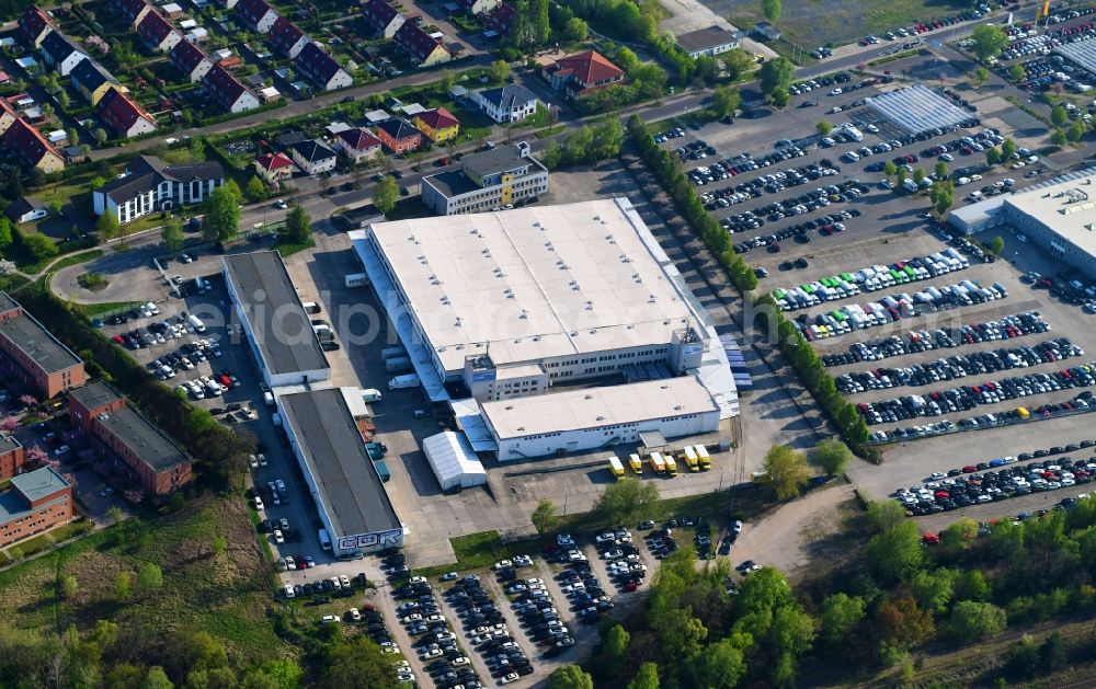 Aerial photograph Hoppegarten - Warehouses and forwarding building of BBF Bike GmbH on Carenaallee in Hoppegarten in the state Brandenburg, Germany