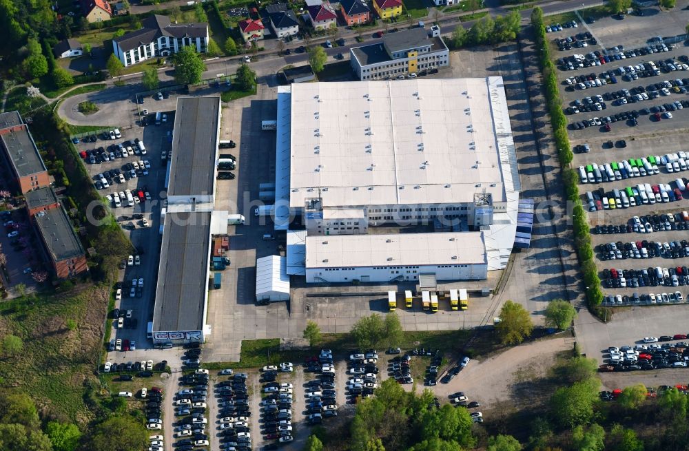 Hoppegarten from above - Warehouses and forwarding building of BBF Bike GmbH on Carenaallee in Hoppegarten in the state Brandenburg, Germany