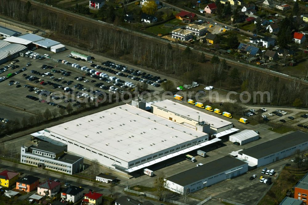 Hoppegarten from above - Warehouses and forwarding building of BBF Bike GmbH on Carenaallee in Hoppegarten in the state Brandenburg, Germany