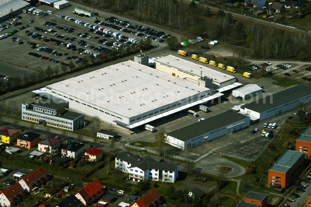 Hoppegarten from the bird's eye view: Warehouses and forwarding building of BBF Bike GmbH on Carenaallee in Hoppegarten in the state Brandenburg, Germany