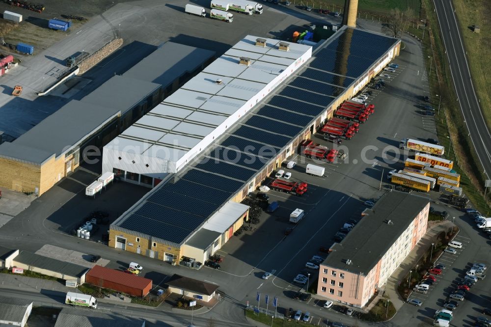 Taucha from above - Warehouses and forwarding building Gilles & Wagner Spedition GmbH & Co. KG on Poenitzer Weg in Taucha in the state Saxony