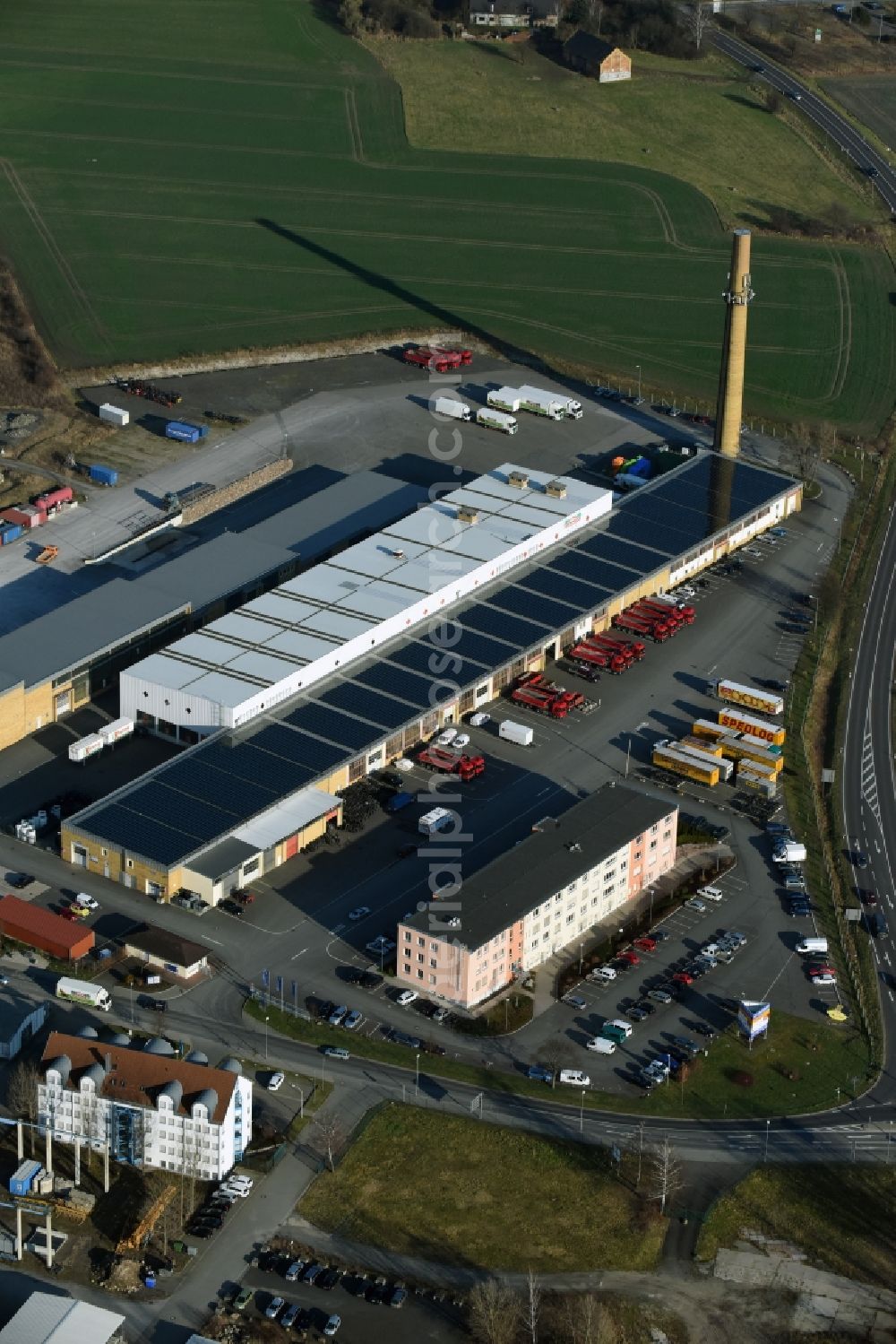 Aerial photograph Taucha - Warehouses and forwarding building Gilles & Wagner Spedition GmbH & Co. KG on Poenitzer Weg in Taucha in the state Saxony