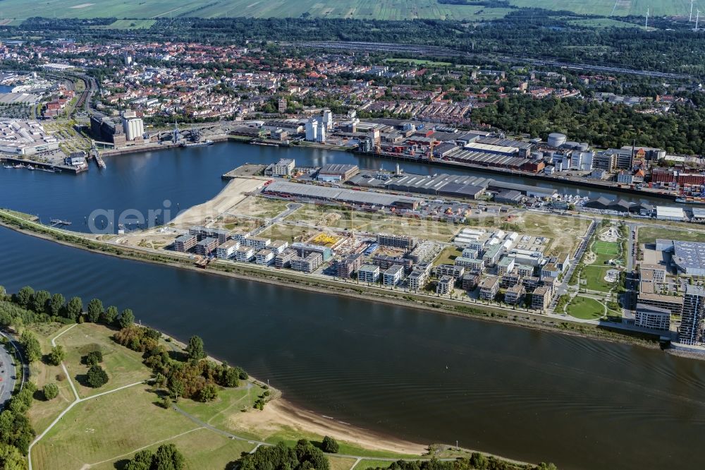 Bremen from above - Warehouses and forwarding building on Weser river in the district Ueberseestadt in Bremen, Germany