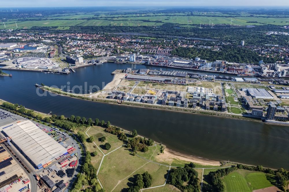 Bremen from the bird's eye view: Warehouses and forwarding building on Weser river in the district Ueberseestadt in Bremen, Germany