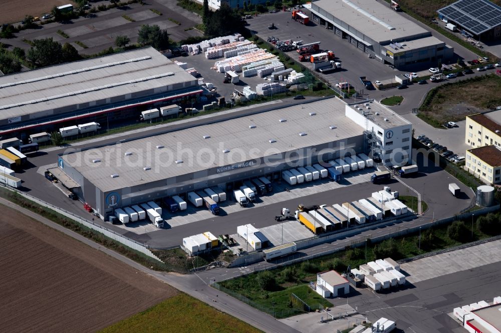 Ilsfeld from the bird's eye view: Warehouses and forwarding building of Kuehne + Nagel (AG & Co.) KG on Robert-Kohlhammer-Strasse in Ilsfeld in the state Baden-Wurttemberg, Germany