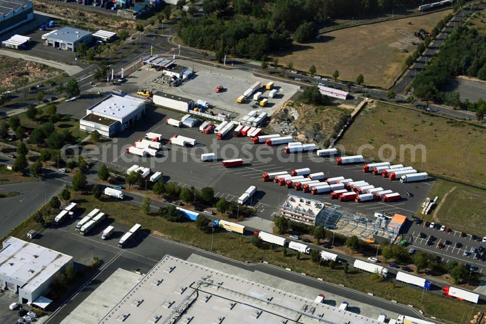 Aerial image Grünheide (Mark) - Warehouses and forwarding building of Ludwig Meyer GmbH & Co. KG overlooking a construction site on Birkenstrasse in the district Freienbrink in Gruenheide (Mark) in the state Brandenburg, Germany