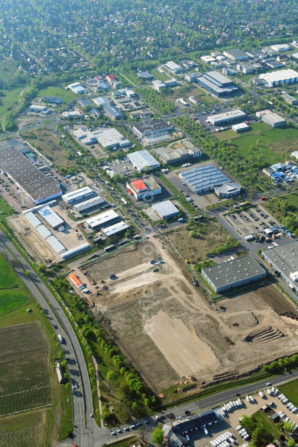 Hoppegarten from the bird's eye view: Construction site for a warehouse and forwarding building Digitalstrasse- Neuer Hoenower Weg on federal street B1 in the district Dahlwitz-Hoppegarten in Hoppegarten in the state Brandenburg, Germany