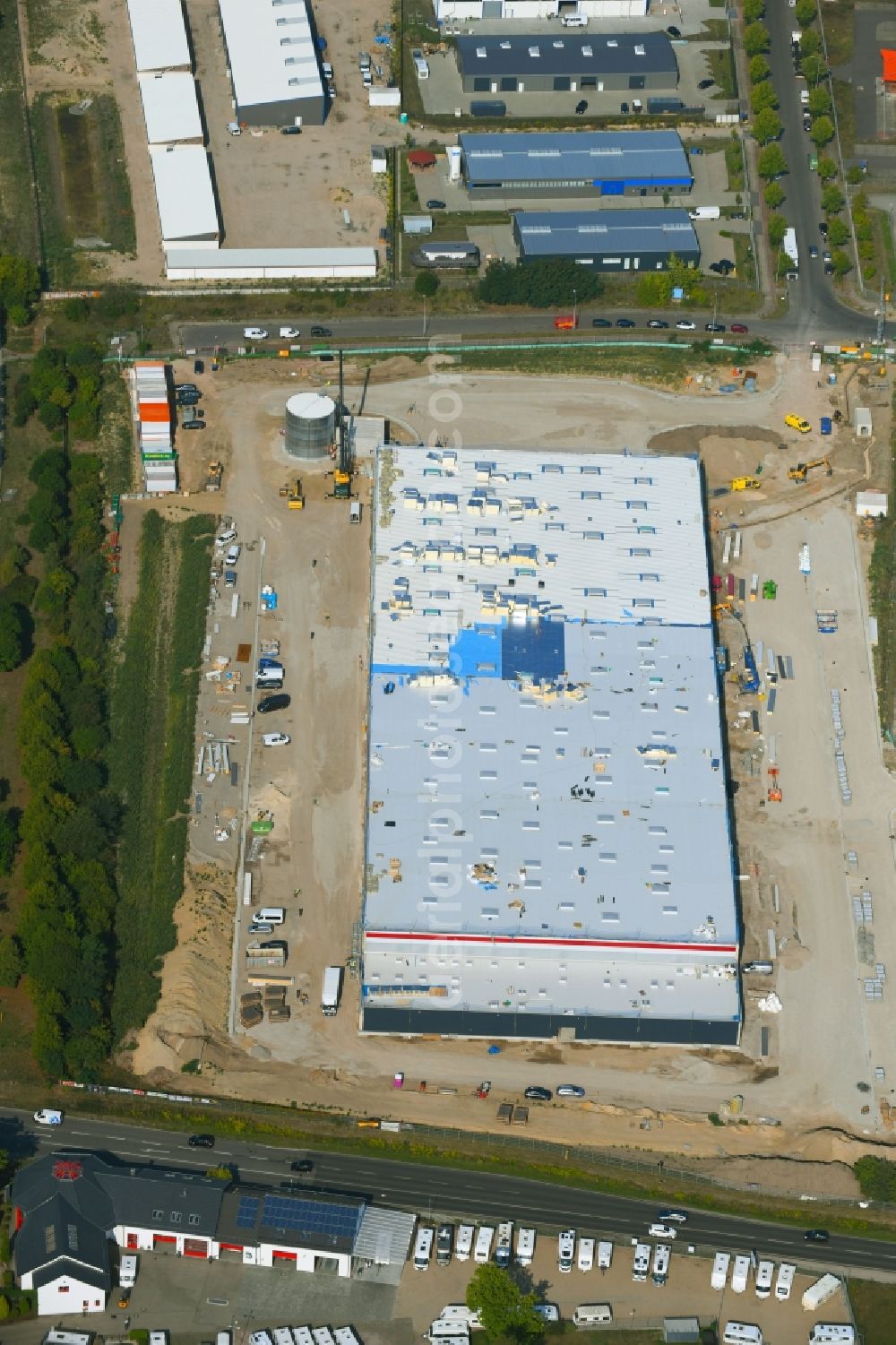 Hoppegarten from the bird's eye view: Construction site for a warehouse and forwarding building Digitalstrasse- Neuer Hoenower Weg on federal street B1 in the district Dahlwitz-Hoppegarten in Hoppegarten in the state Brandenburg, Germany