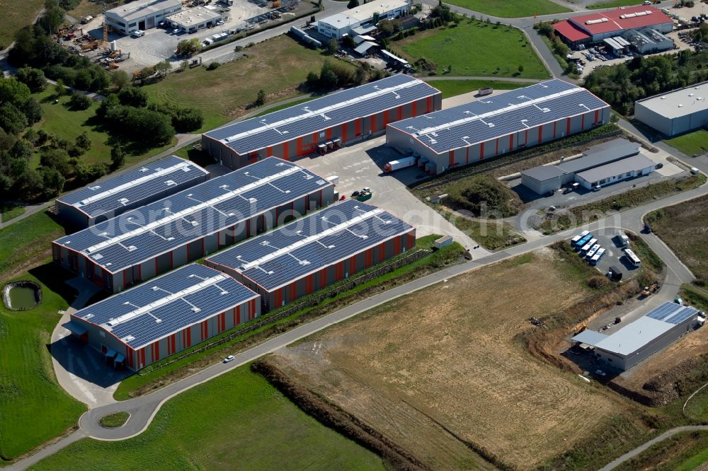 Osterburken from the bird's eye view: Warehouses and forwarding building of Ruedinger Spedition GmbH at Industriepark in Osterburken in the state Baden-Wurttemberg, Germany