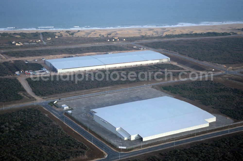 PORT ELIZABETH from the bird's eye view: Warehouse of P E Cold Storage Ltd. in the industrial area at the coast of Port Elizabeth, South Africa. The region's industrial landscape is especially dominated by several weaving mills and the car industry