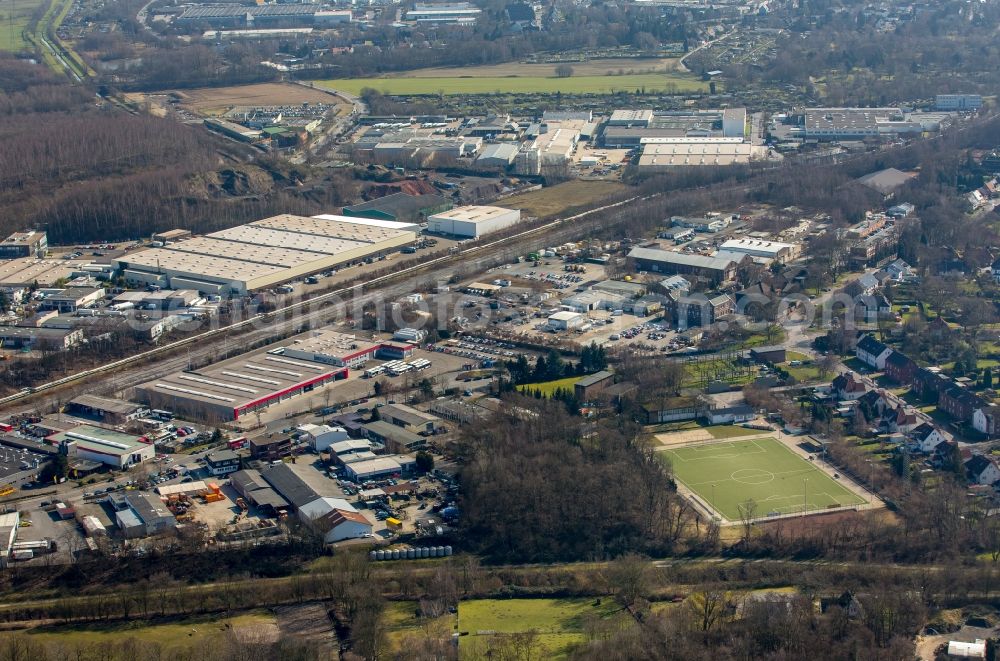 Aerial image Bottrop - Warehouse complex-building in a commercial area in Bottrop own in North Rhine-Westphalia. In the foreground the sports grounds of SV Fortuna Bottrop 1932 e.V., centrally, a deposit of Vestische streetcars GmbH and others