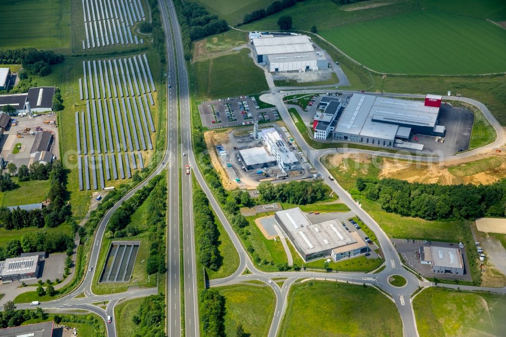 Aerial photograph Meschede - Warehouse complex-building in the industrial area Enste Nord an der A 46 in Meschede in the state North Rhine-Westphalia, Germany with settlements of the Companies EVENTTECHNIK SUeDWESTFALEN, ITH GmbH & Co. KG, SH Anbaugeraete GmbH and Feuerwehrverband Hochsauerlandkreis e.V