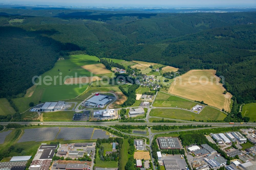 Meschede from above - Warehouse complex-building in the industrial area Enste Nord an der A 46 in Meschede in the state North Rhine-Westphalia, Germany with settlements of the Companies EVENTTECHNIK SUeDWESTFALEN, ITH GmbH & Co. KG, SH Anbaugeraete GmbH and Feuerwehrverband Hochsauerlandkreis e.V