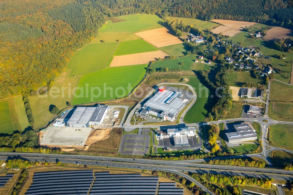 Aerial image Meschede - Warehouse complex-building in the industrial area Enste Nord an der A 46 in Meschede in the state North Rhine-Westphalia, Germany with settlements of the Companies EVENTTECHNIK SUeDWESTFALEN, ITH GmbH & Co. KG, SH Anbaugeraete GmbH and Feuerwehrverband Hochsauerlandkreis e.V