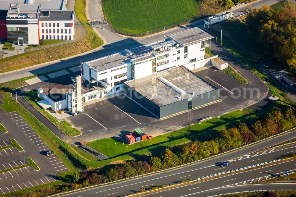 Meschede from above - Warehouse complex-building in the industrial area Enste Nord an der A 46 in Meschede in the state North Rhine-Westphalia, Germany with settlements of the Companies EVENTTECHNIK SUeDWESTFALEN, ITH GmbH & Co. KG, SH Anbaugeraete GmbH and Feuerwehrverband Hochsauerlandkreis e.V