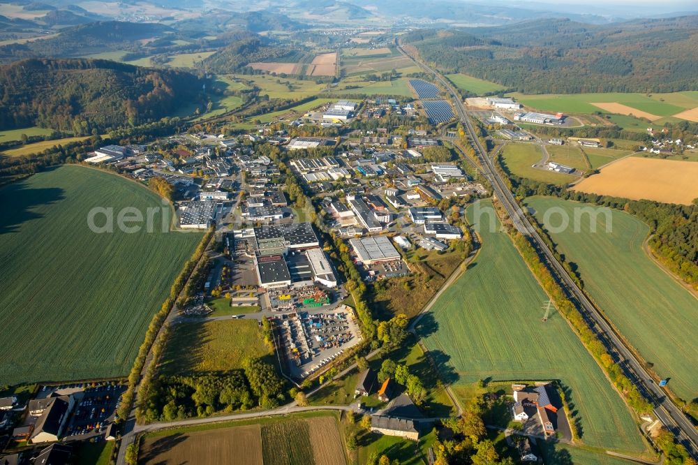 Aerial image Meschede - Warehouse complex-building in the industrial area Enste Nord an der A 46 in Meschede in the state North Rhine-Westphalia, Germany with settlements of the Companies EVENTTECHNIK SUeDWESTFALEN, ITH GmbH & Co. KG, SH Anbaugeraete GmbH and Feuerwehrverband Hochsauerlandkreis e.V