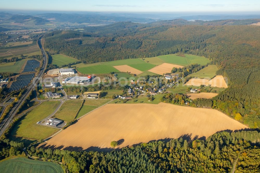 Meschede from above - Warehouse complex-building in the industrial area Enste Nord an der A 46 in Meschede in the state North Rhine-Westphalia, Germany with settlements of the Companies EVENTTECHNIK SUeDWESTFALEN, ITH GmbH & Co. KG, SH Anbaugeraete GmbH and Feuerwehrverband Hochsauerlandkreis e.V