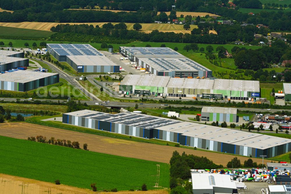 Mienenbüttel from the bird's eye view: Warehouse complex-building in the industrial area on street BAB Autobahn A1 - Schlepelsberg in Mienenbuettel in the state Lower Saxony, Germany