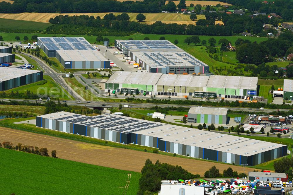 Aerial photograph Mienenbüttel - Warehouse complex-building in the industrial area on street BAB Autobahn A1 - Schlepelsberg in Mienenbuettel in the state Lower Saxony, Germany