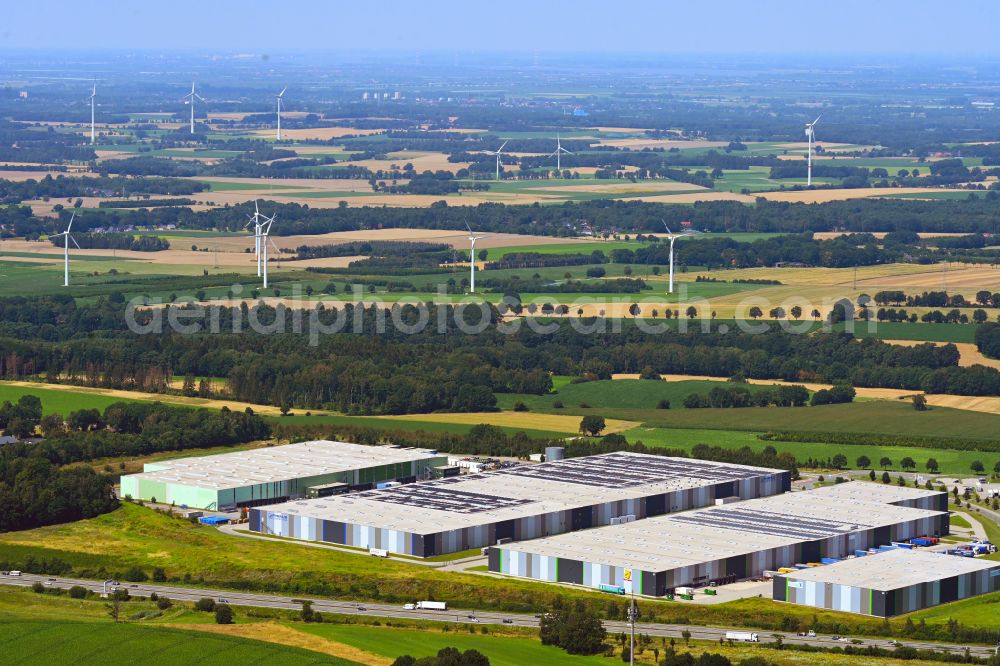 Mienenbüttel from the bird's eye view: Warehouse complex-building in the industrial area on street BAB Autobahn A1 - Schlepelsberg in Mienenbuettel in the state Lower Saxony, Germany