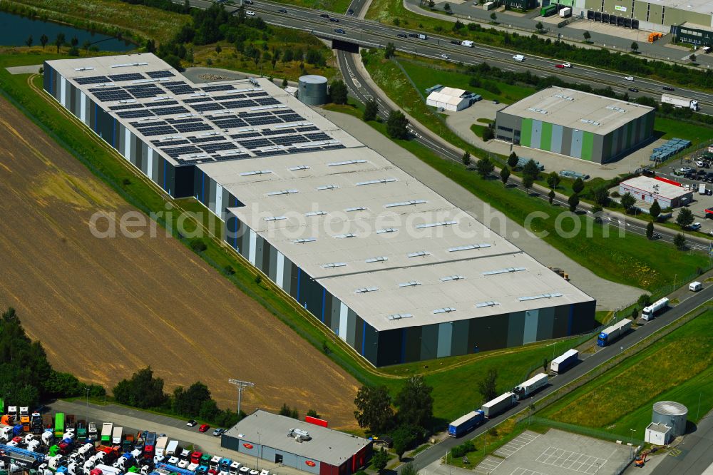 Aerial photograph Mienenbüttel - Warehouse complex-building in the industrial area on street BAB Autobahn A1 - Schlepelsberg in Mienenbuettel in the state Lower Saxony, Germany