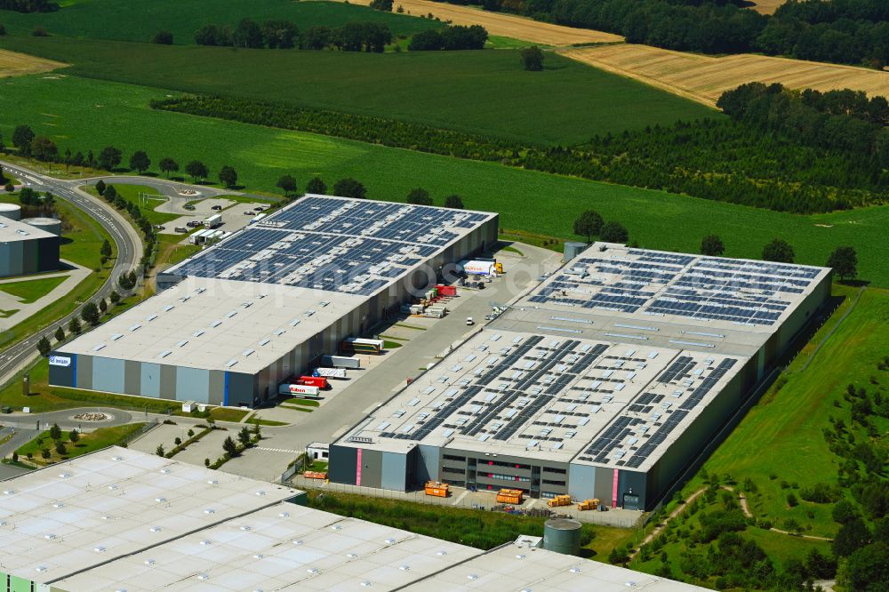 Mienenbüttel from the bird's eye view: Warehouse complex-building in the industrial area on street BAB Autobahn A1 - Schlepelsberg in Mienenbuettel in the state Lower Saxony, Germany