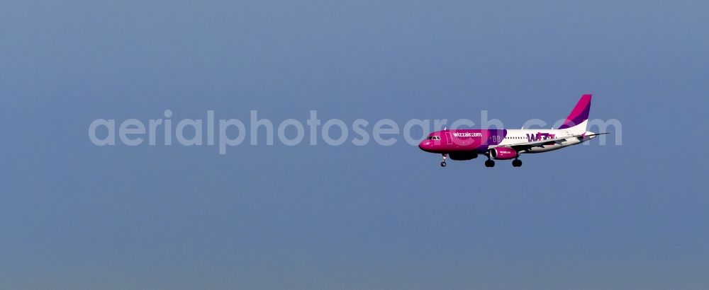 Dortmund from the bird's eye view: Landing approach of an Airbus A320 on the runway of the airport Dortmund Wickede in North Rhine-Westphalia. The Wizz Air is a 2004 founded Ukrainian air carriers