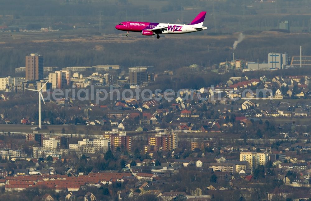 Dortmund from the bird's eye view: Landing approach of an Airbus A320 on the runway of the airport Dortmund Wickede in North Rhine-Westphalia. The Wizz Air is a 2004 founded Ukrainian air carriers